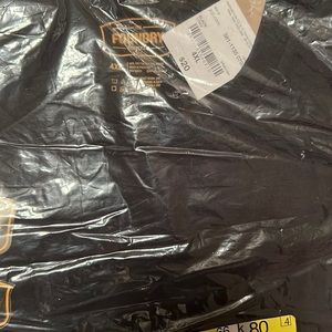Brand new T-shirt still in the package with tag